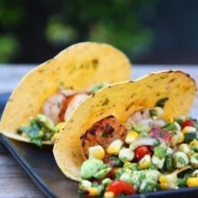 shrimp tacos served with grilled vegetable salsa