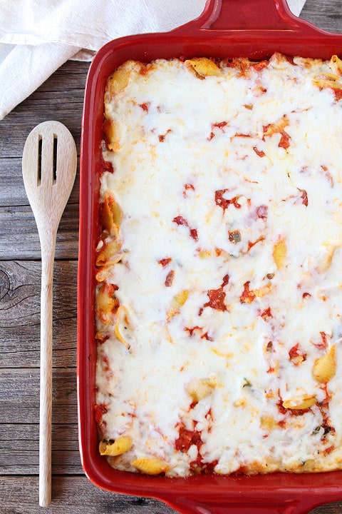 ricotta pasta bake with spinach in casserole dish 
