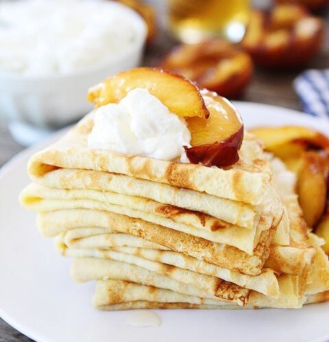 https://www.twopeasandtheirpod.com/wp-content/uploads/2013/07/Crepes-with-Grilled-Peaches-n-Cream-13-480x500.jpg