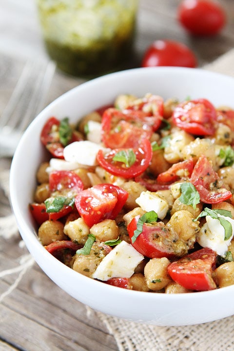 Chickpea, Pesto, Tomato, and Mozzarella Salad Recipe on twopeasandtheirpod.com You can make this healthy salad in under 10 minutes! #salad #recipe