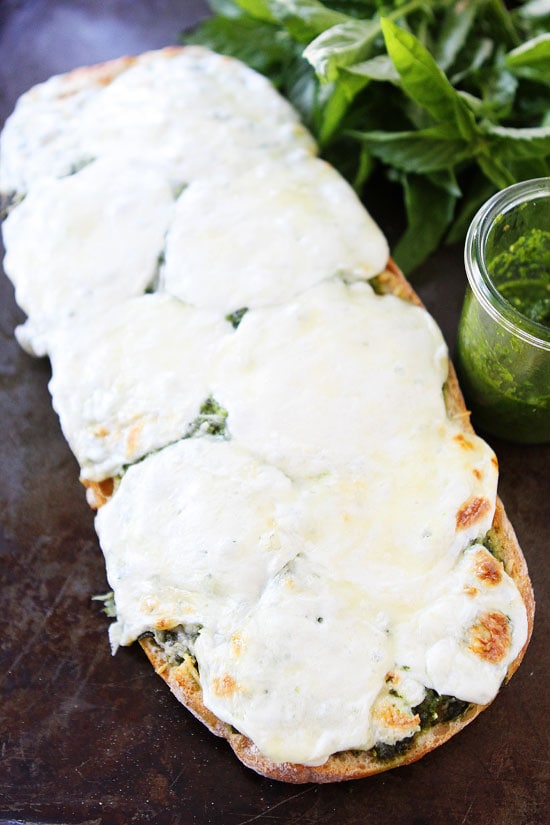 Pesto Cheese Bread Recipe on twopeasandtheirpod.com Love this easy and cheesy bread recipe! #recipe #bread