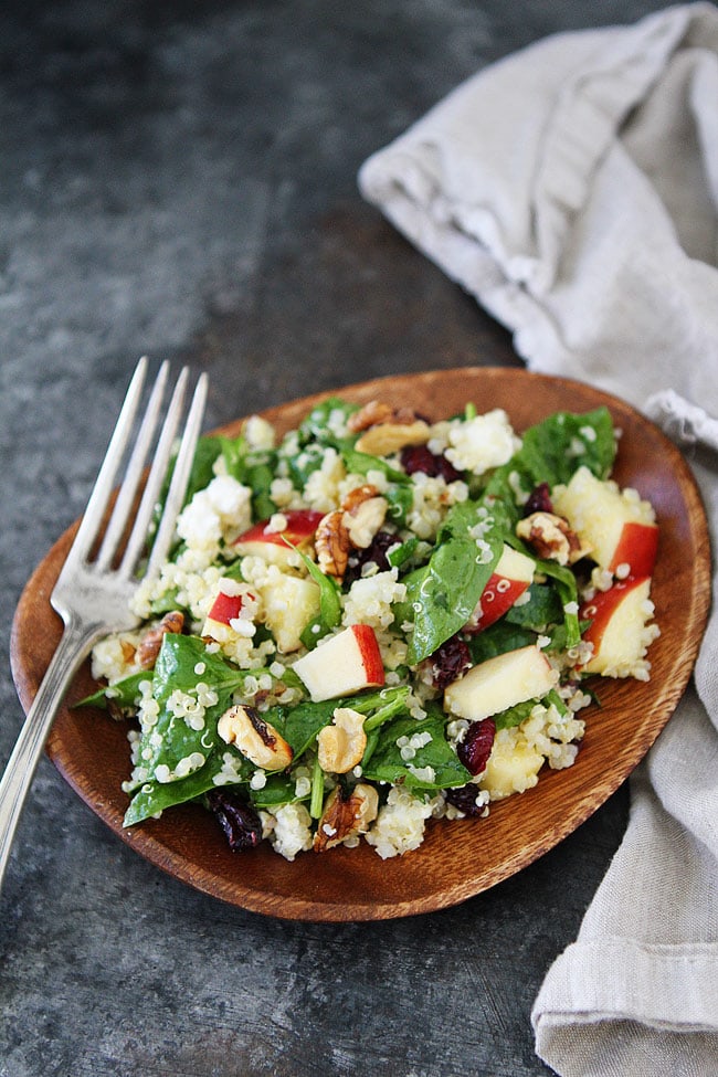 Apple Walnut Quinoa Salad with spinach, dried cranberries, goat cheese, and a simple maple mustard dressing is the perfect salad for fall.