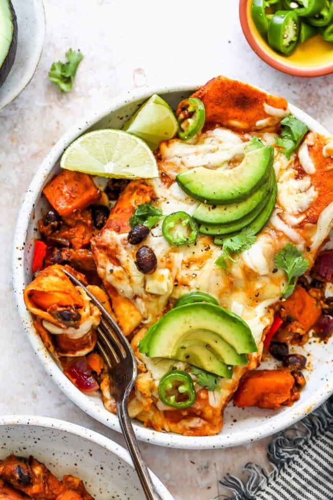 Butternut Squash enchiladas on plate with fork