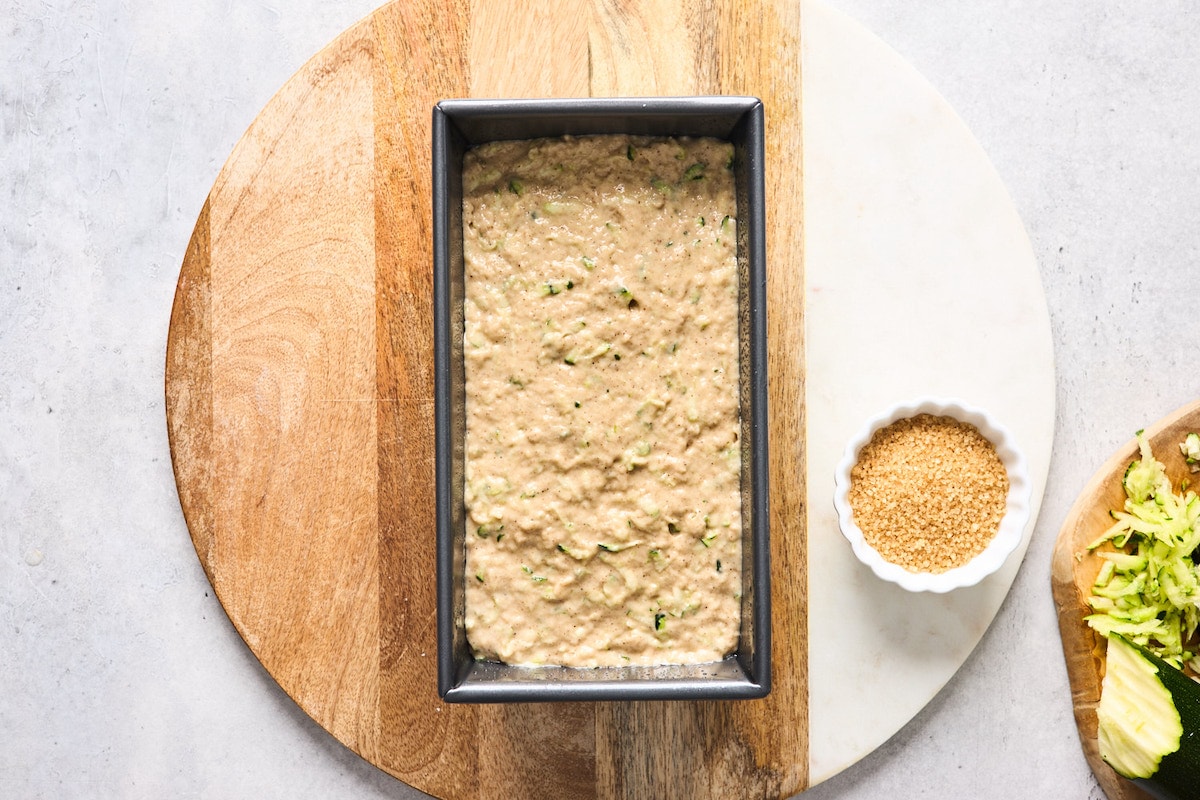 healthy zucchini bread batter in loaf pan. 