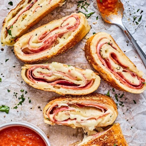 https://www.twopeasandtheirpod.com/wp-content/uploads/2022/02/Stromboli-with-sauce-500x500.jpg