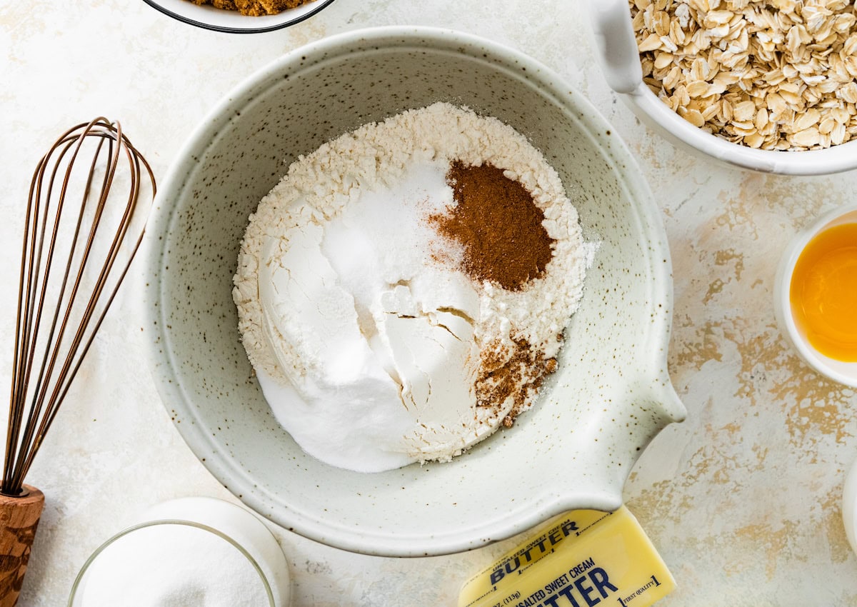 dry ingredients for oatmeal cookies in mixing bowl. 