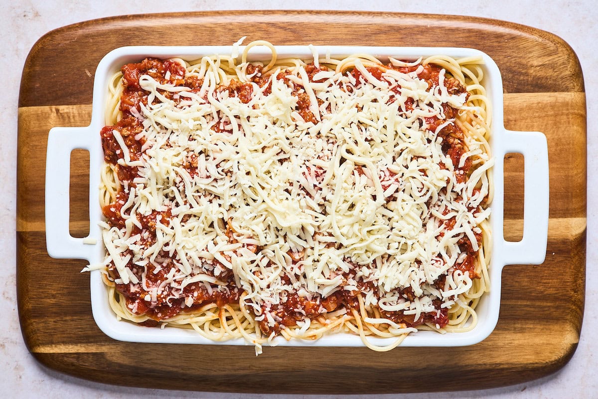 baked spaghetti in baking dish ready to go into the oven. 