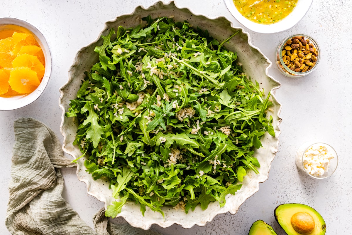 arugula in serving bowl with rice. 