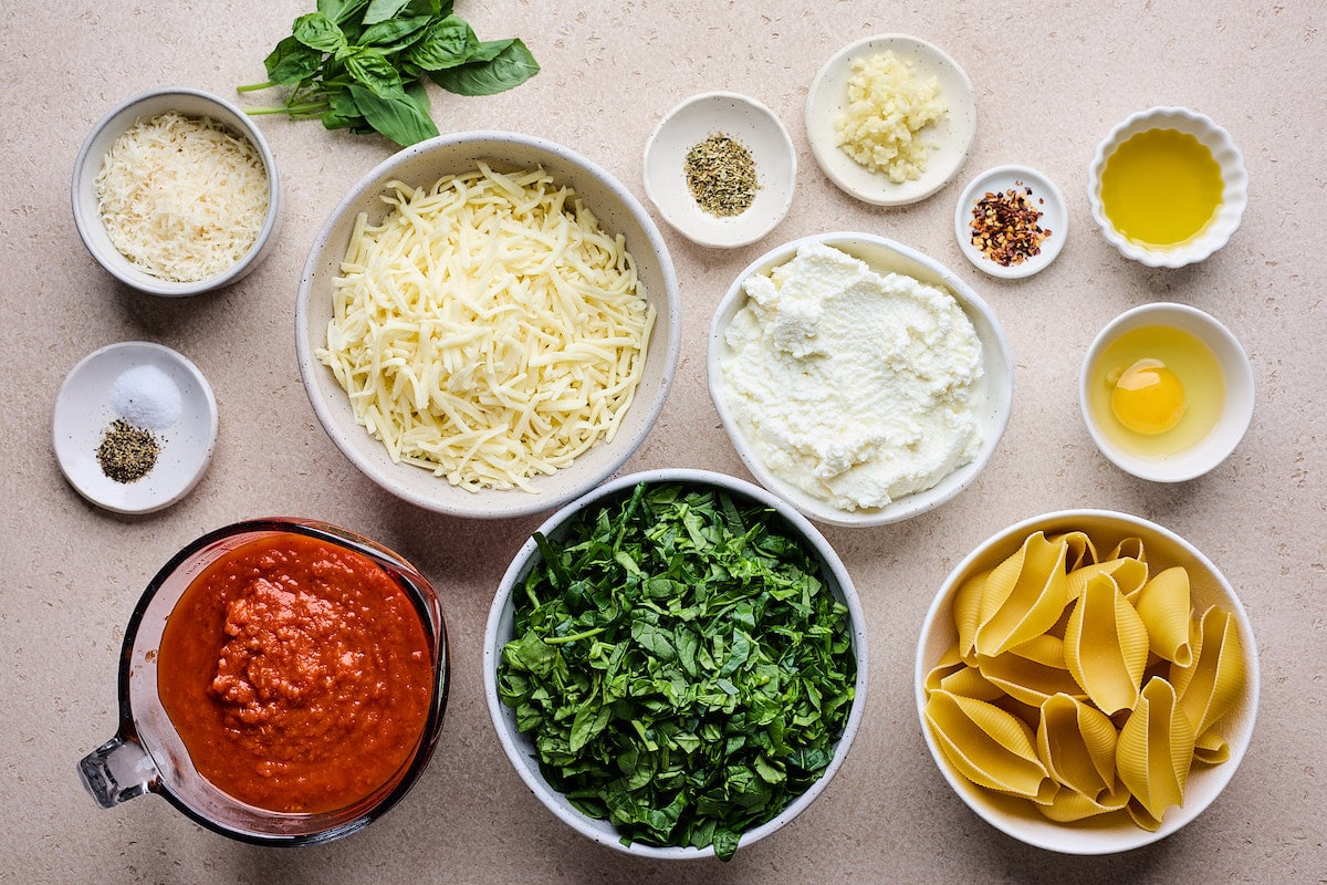 ingredients in bowls to make stuffed shells. 