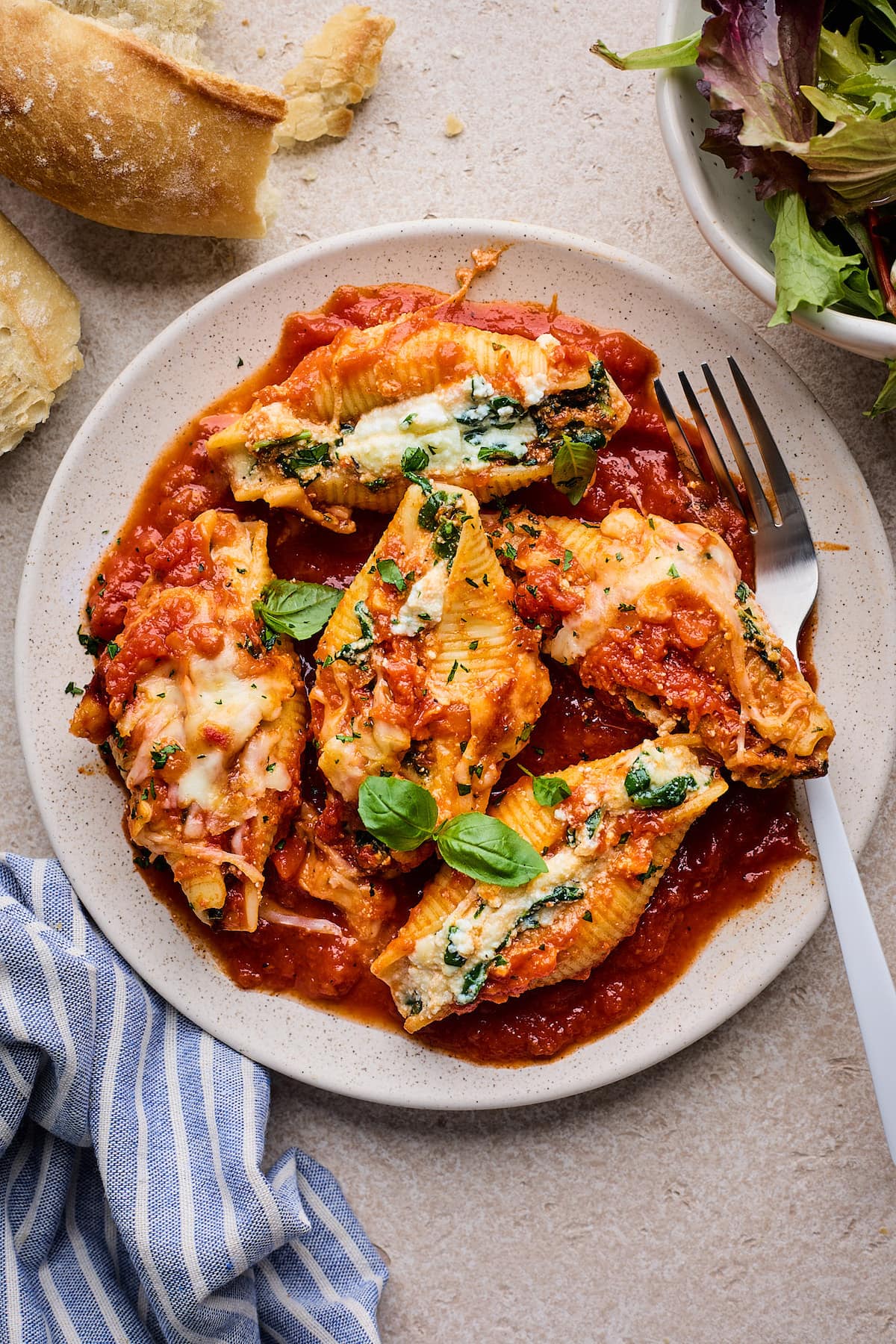 stuffed shells on plate with fork. 
