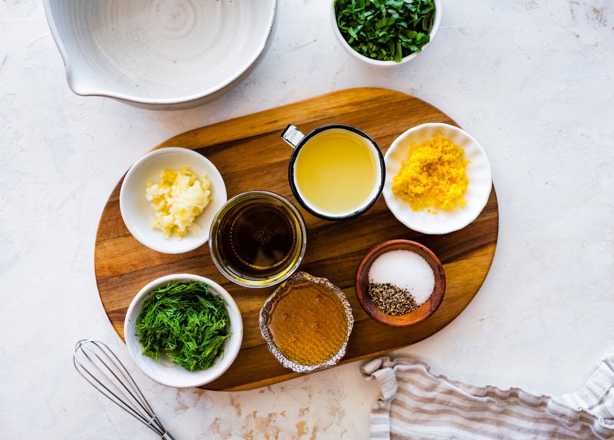 ingredients in bowls to make lemon herb dressing for no mayo potato salad. 
