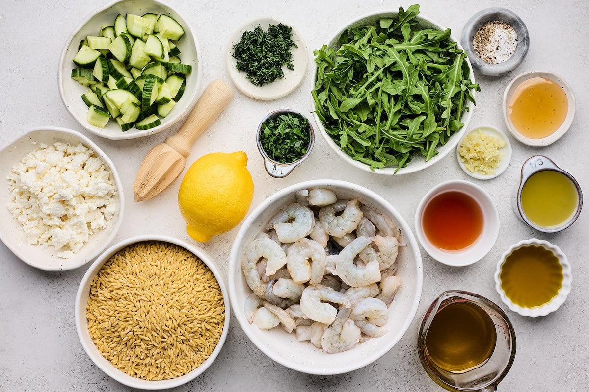 ingredients in bowls to make shrimp orzo salad. 