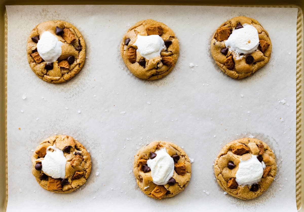 Biscoff s'mores cookies on baking sheet with parchment paper. 