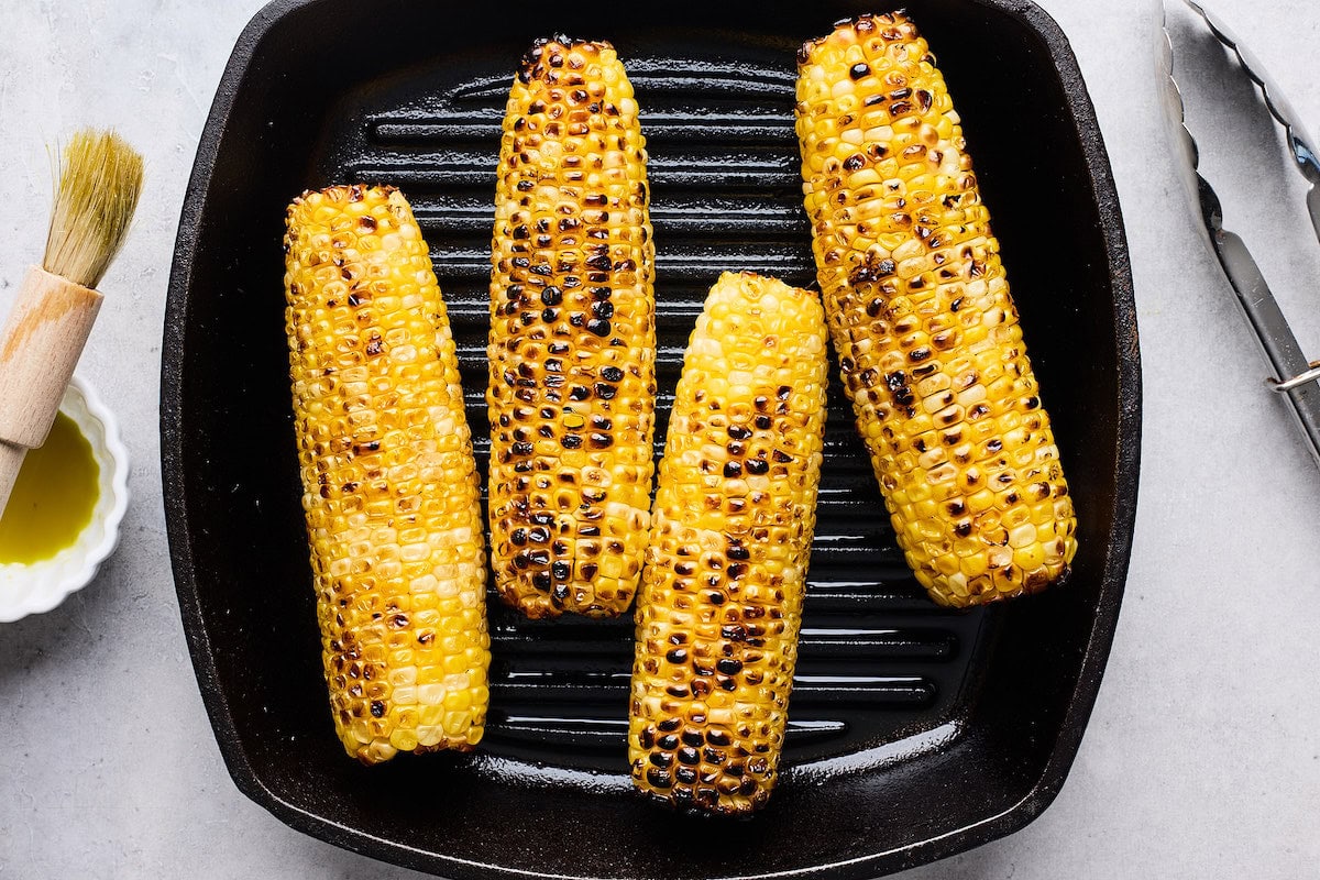 charred corn on grill pan. 