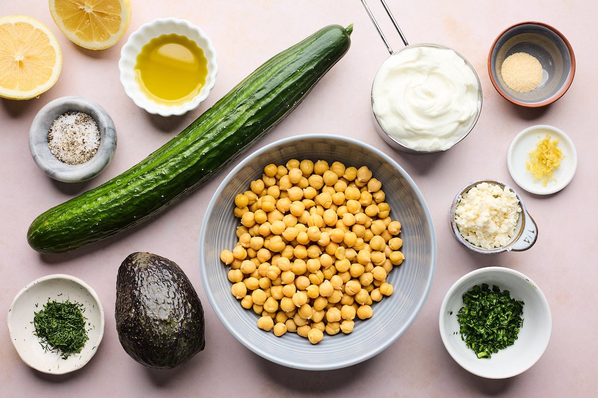 ingredients to make smashed cucumber, avocado, and crispy chickpea salad.