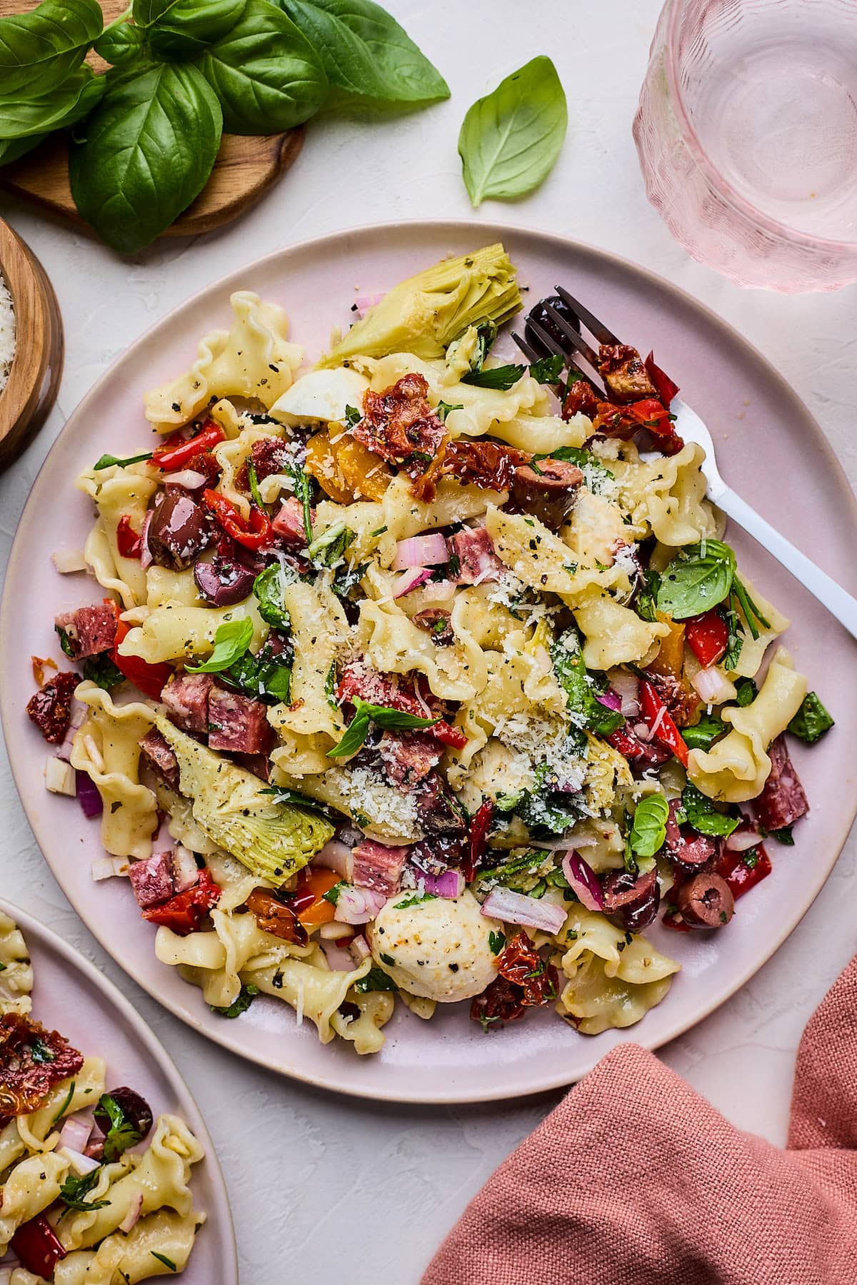 Italian pasta salad on plate with fork. 