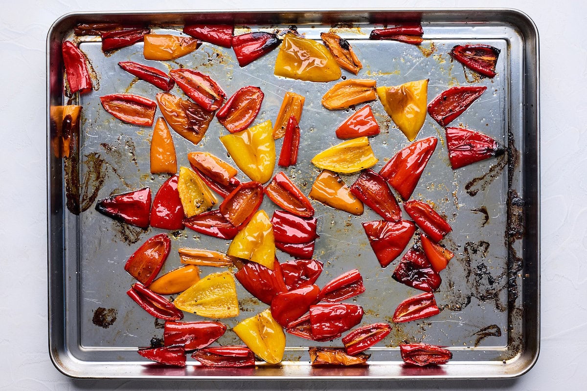 roasted mini bell peppers on baking sheet. 