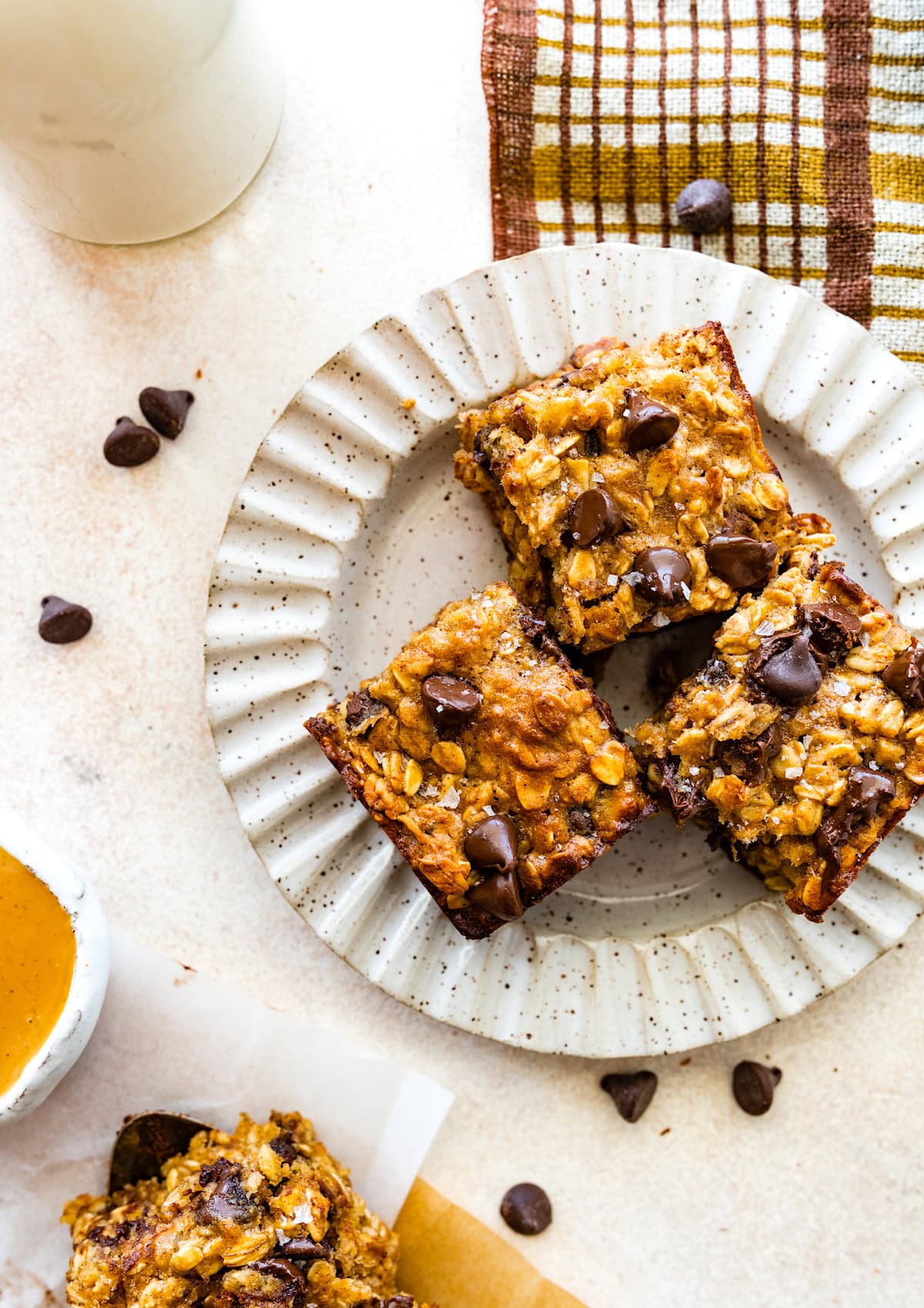 peanut butter banana oatmeal bars with chocolate chips on plate. 