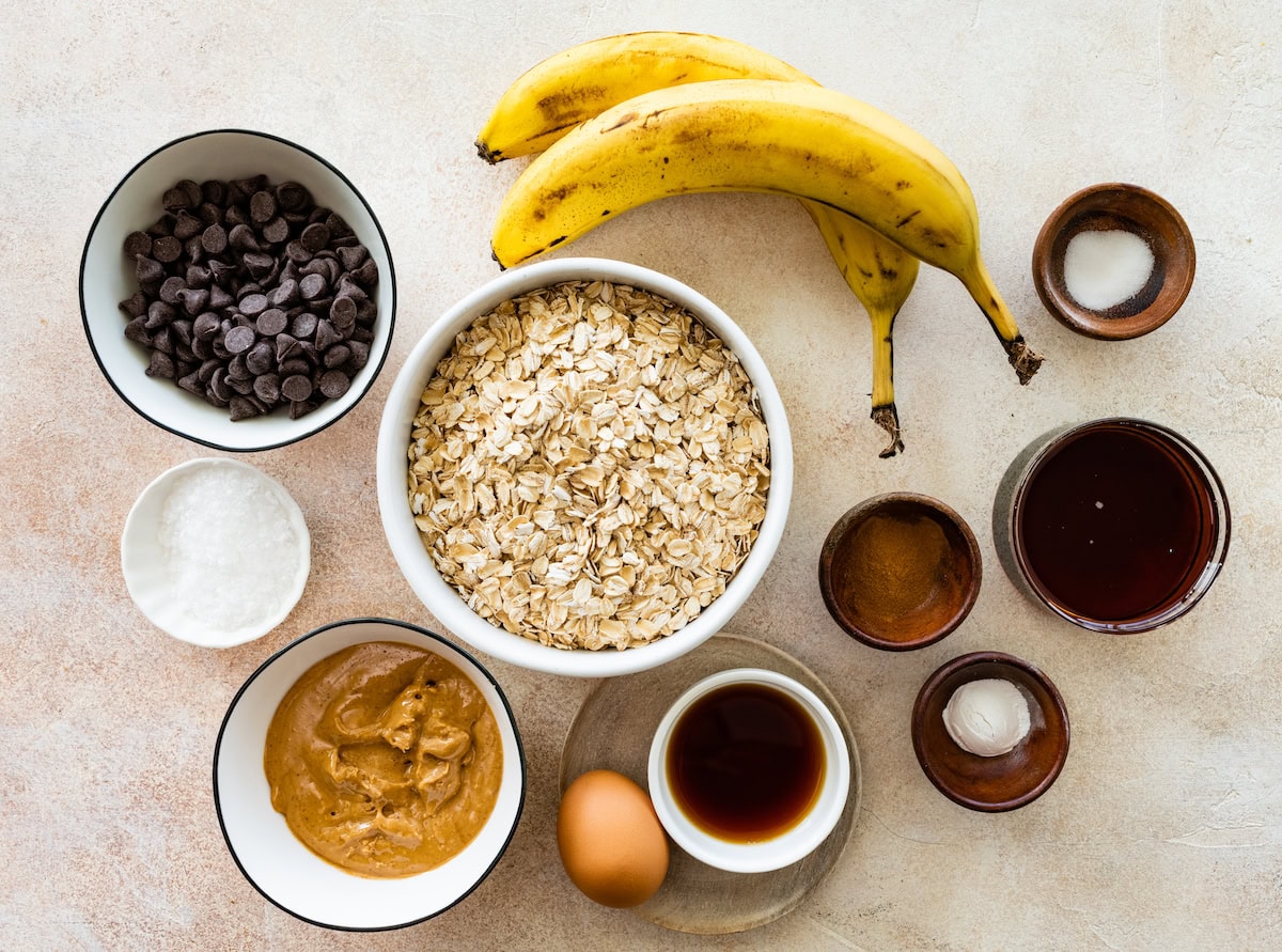 ingredients in bowls to make peanut butter banana oatmeal bars. 