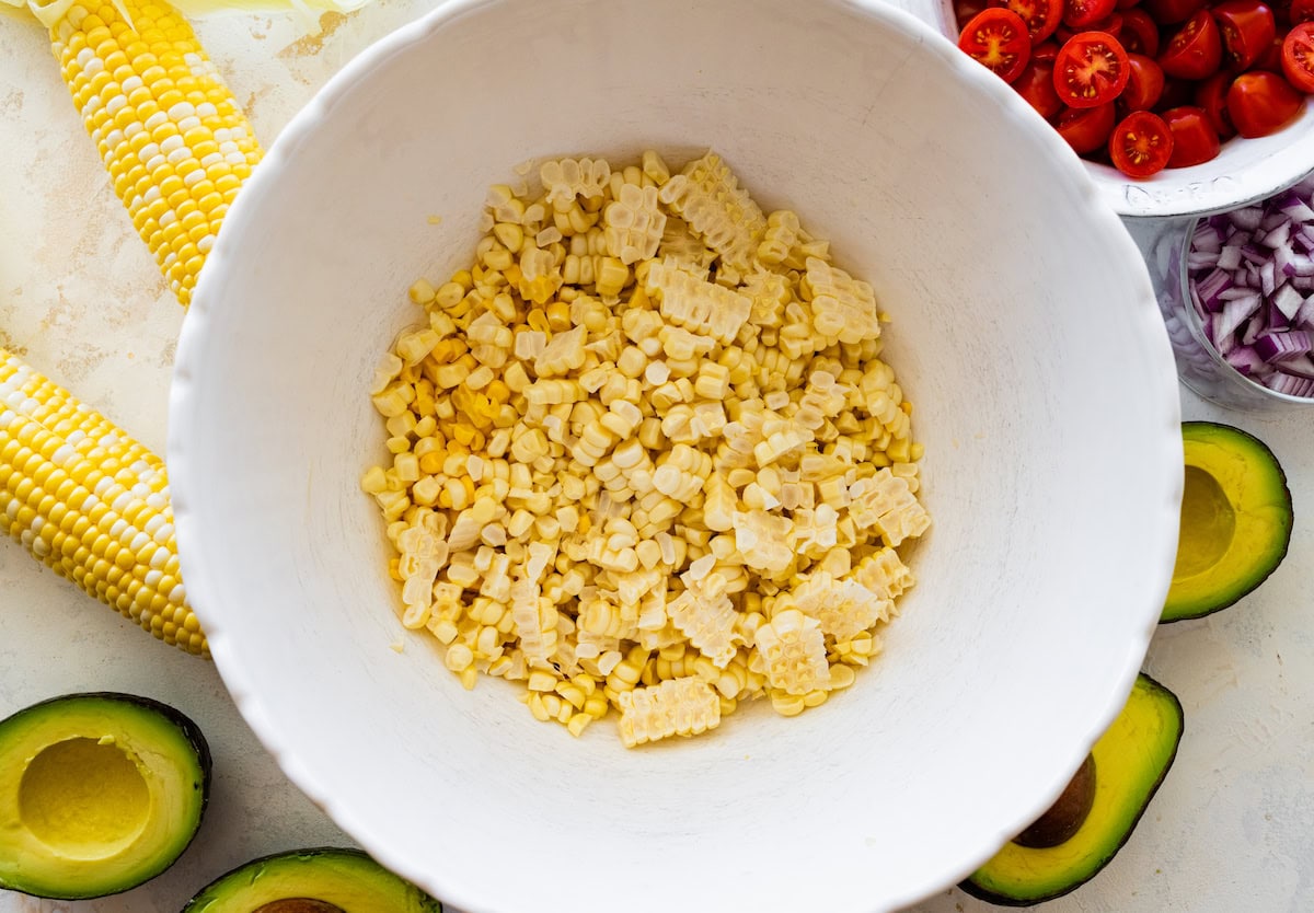 sweet corn kernels in white mixing bowl. 