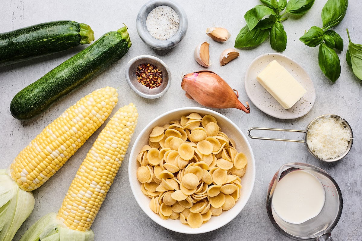 ingredients to make creamy zucchini corn pasta. 