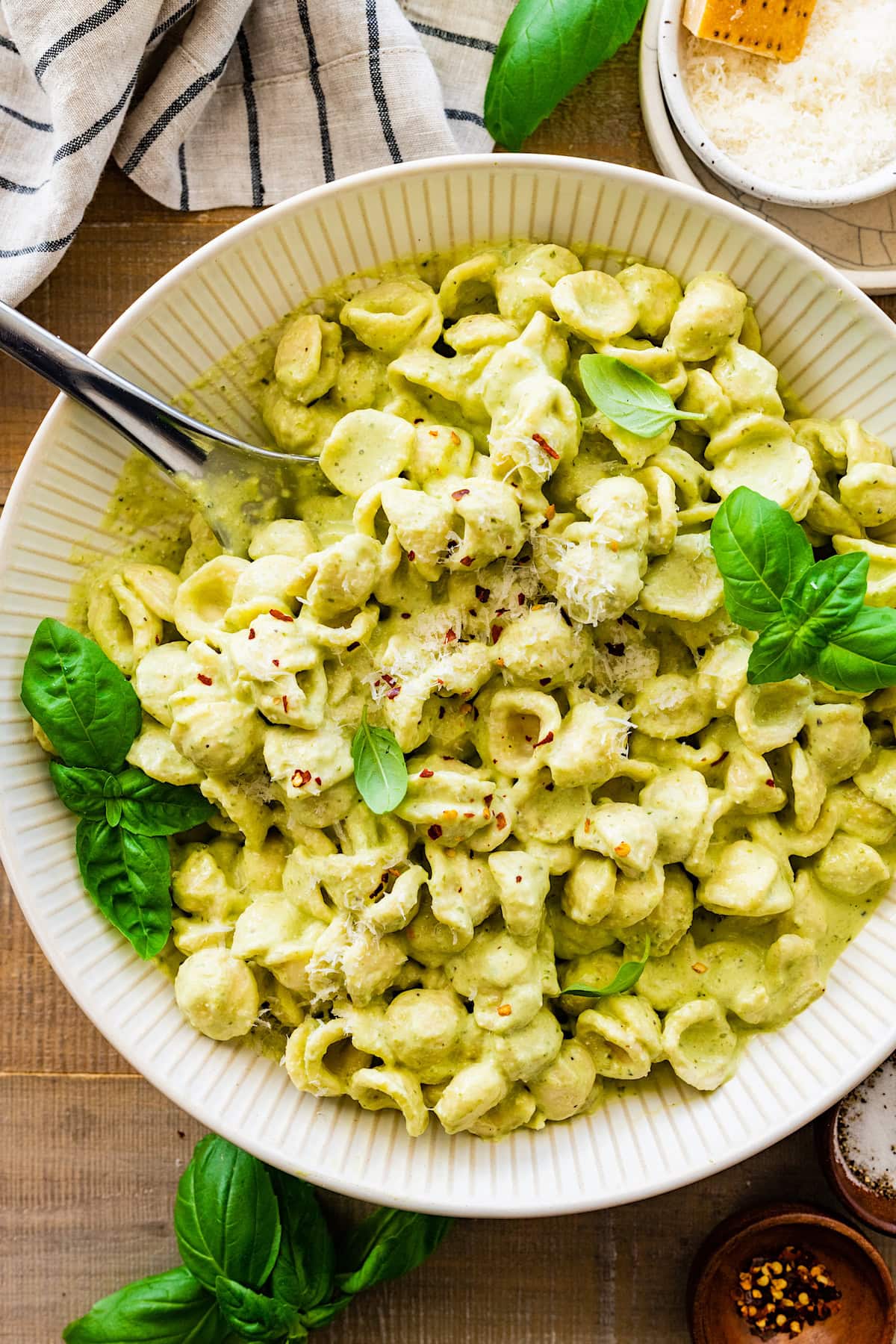 cottage cheese creamy pesto pasta in bowl with fork. 