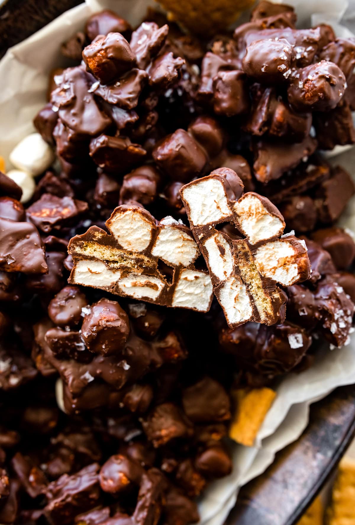 close up of s'mores clusters with mini marshmallows, graham crackers, and chocolate. 