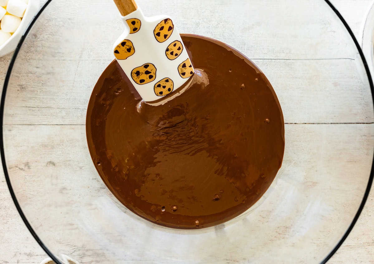 melted chocolate in mixing bowl with spatula. 