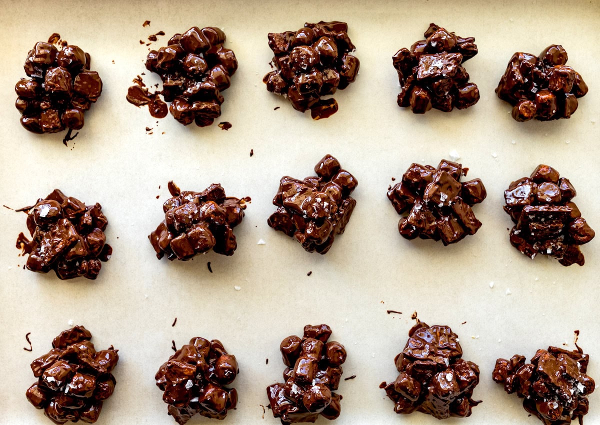 s'mores clusters on baking sheet with parchment paper. 