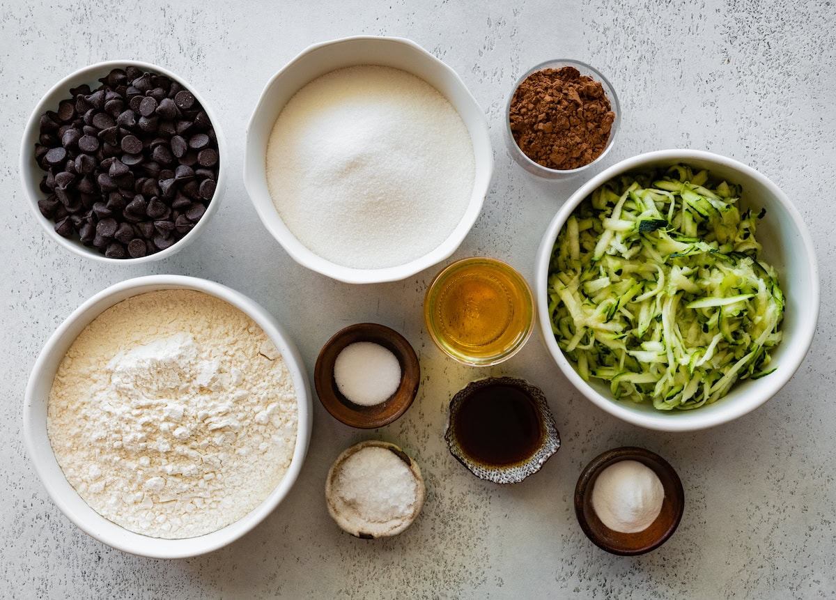 ingredients in bowls to make zucchini brownies. 