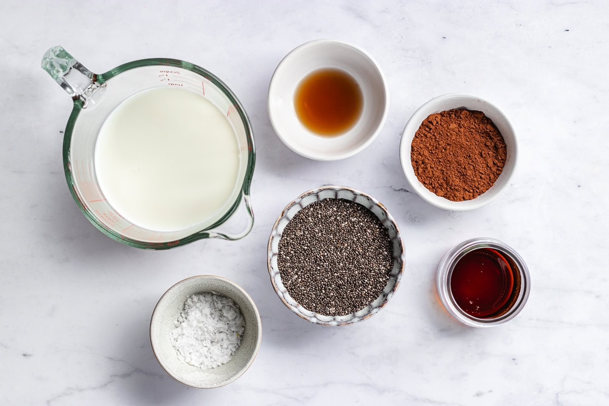 ingredients in bowls to make chocolate chia pudding. 