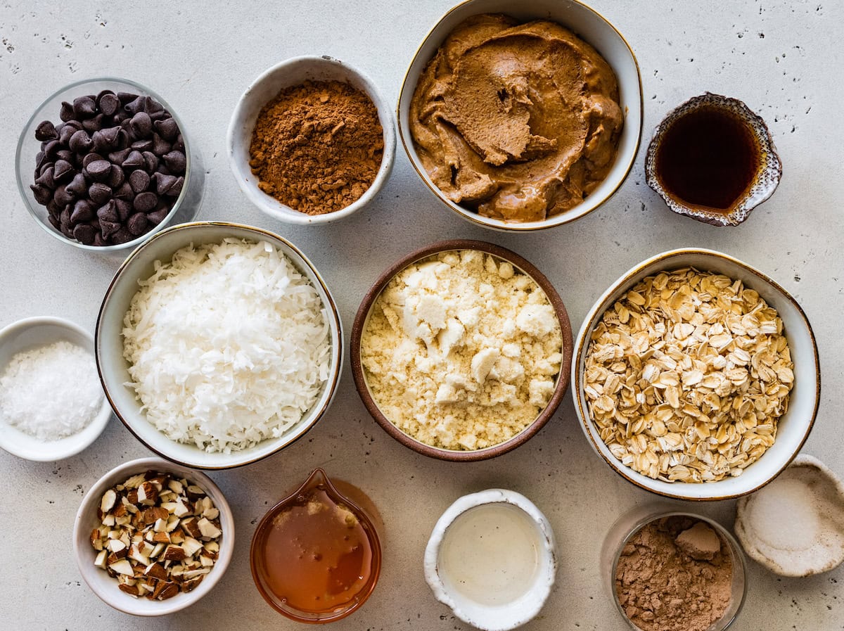 ingredients in bowls to make no bake almond joy bars. 