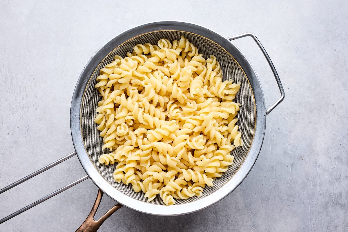 pasta draining in colander. 