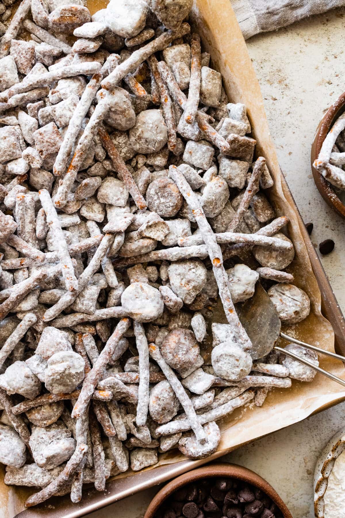 sweet and salty puppy chow on baking sheet. 