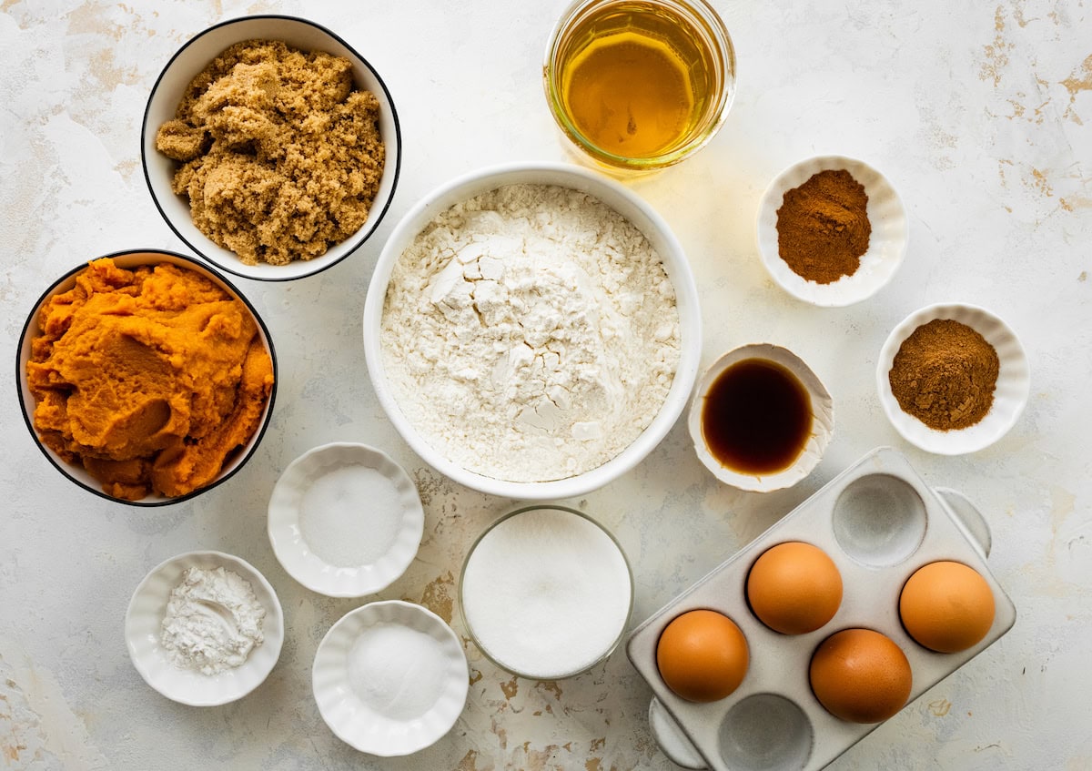 ingredients in bowls to make pumpkin swirl pumpkin cake. 