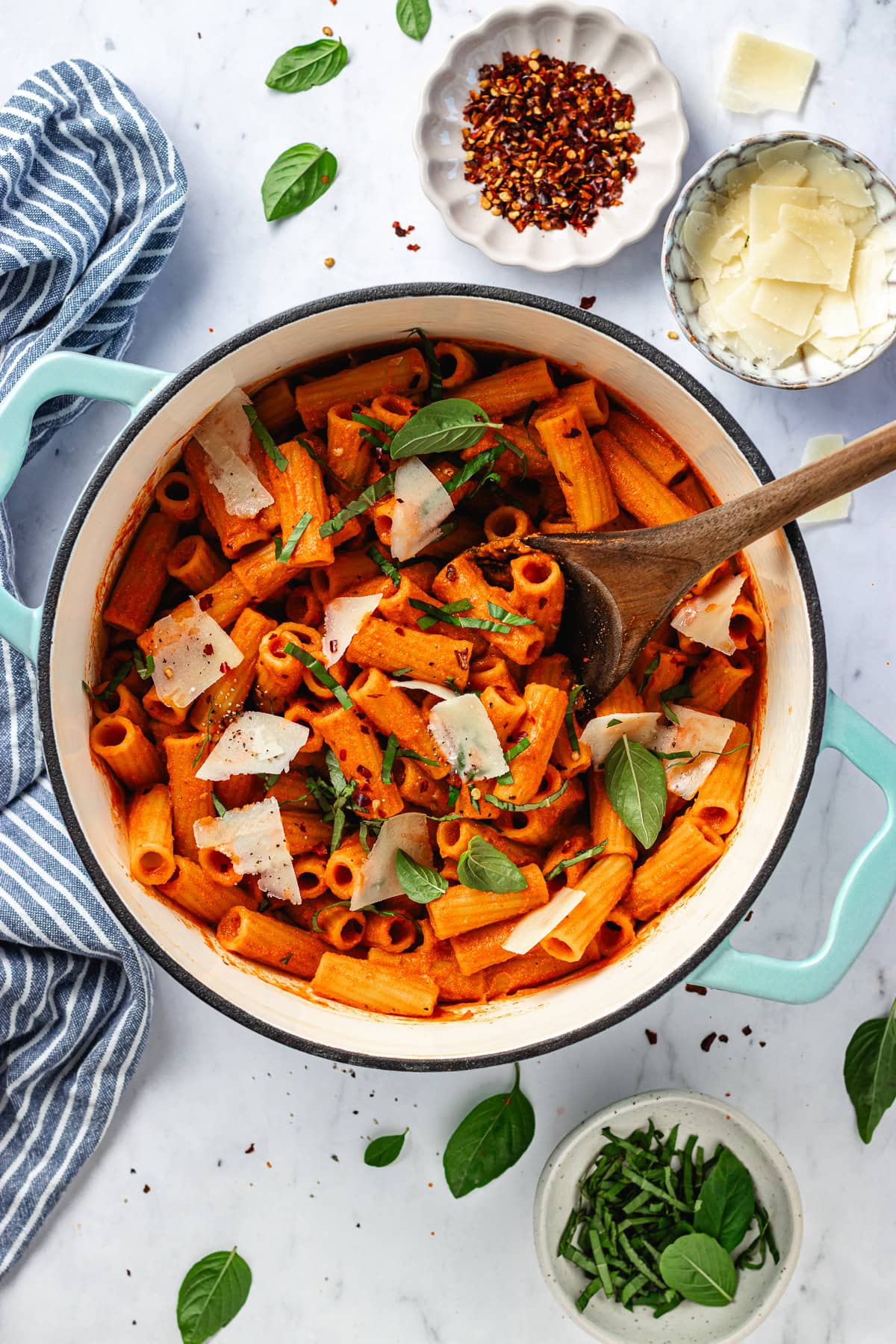 cottage cheese pasta in large pot with wooden spoon. 