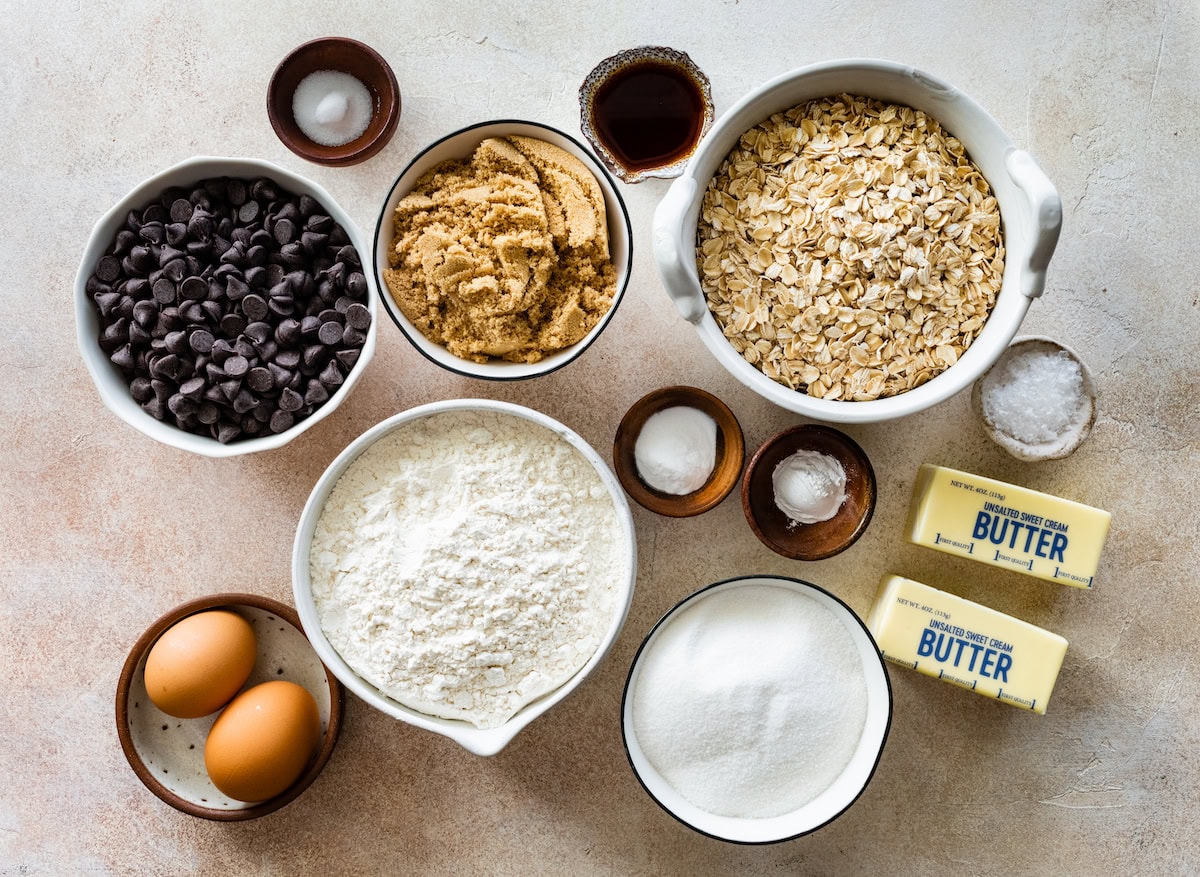 ingredients in bowls to make oatmeal chocolate chip cookies. 