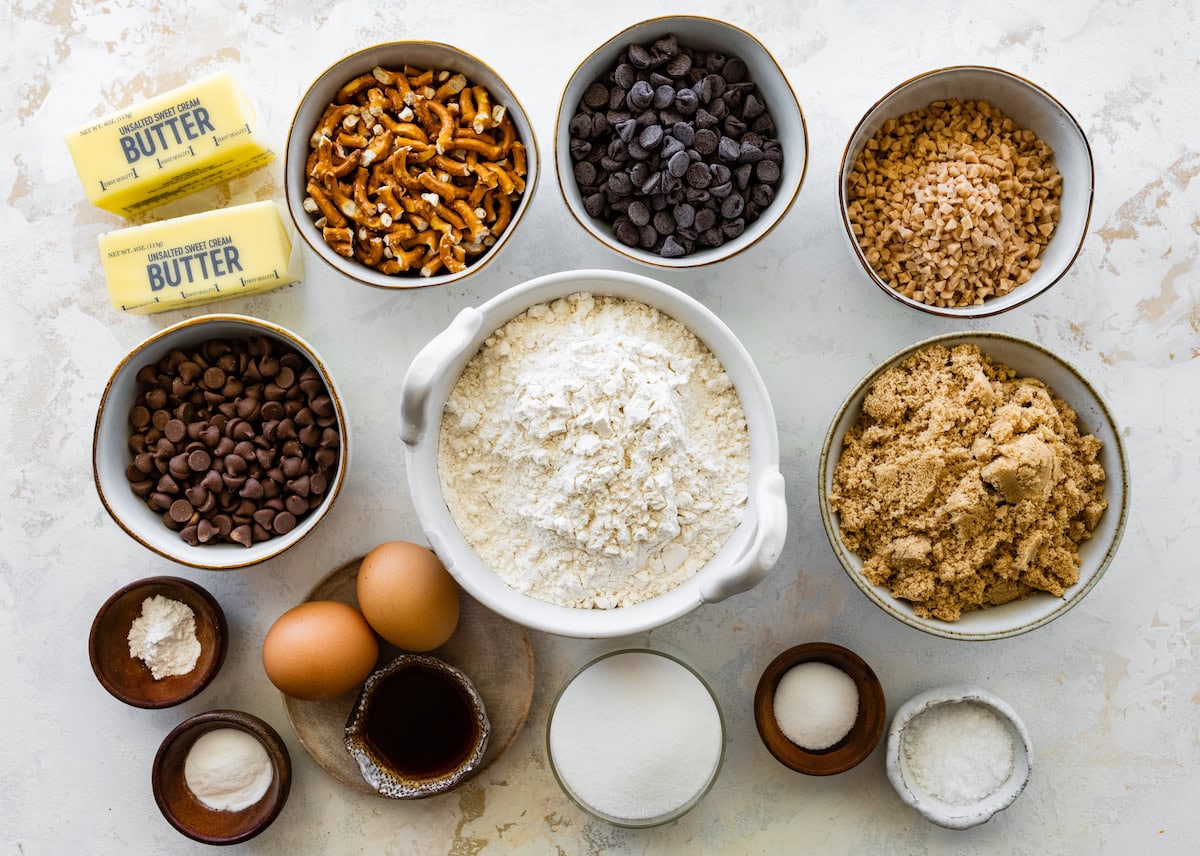 ingredients in bowls to make pretzel toffee chocolate chip cookies. 