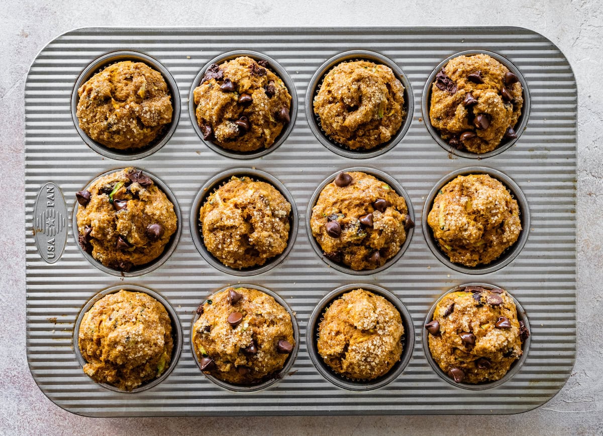 pumpkin zucchini muffins in muffin pan. 