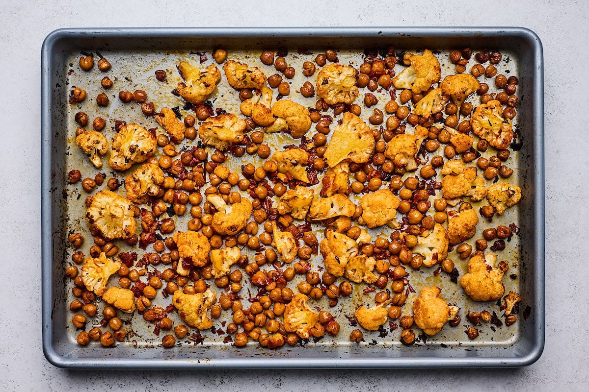 harissa roasted cauliflower and chickpeas on baking sheet. 