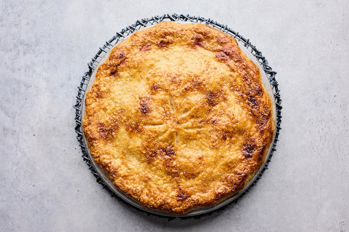 apple pie on cooling rack. 