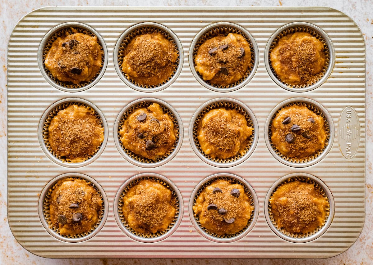 pumpkin banana muffins in pan ready for the oven. 