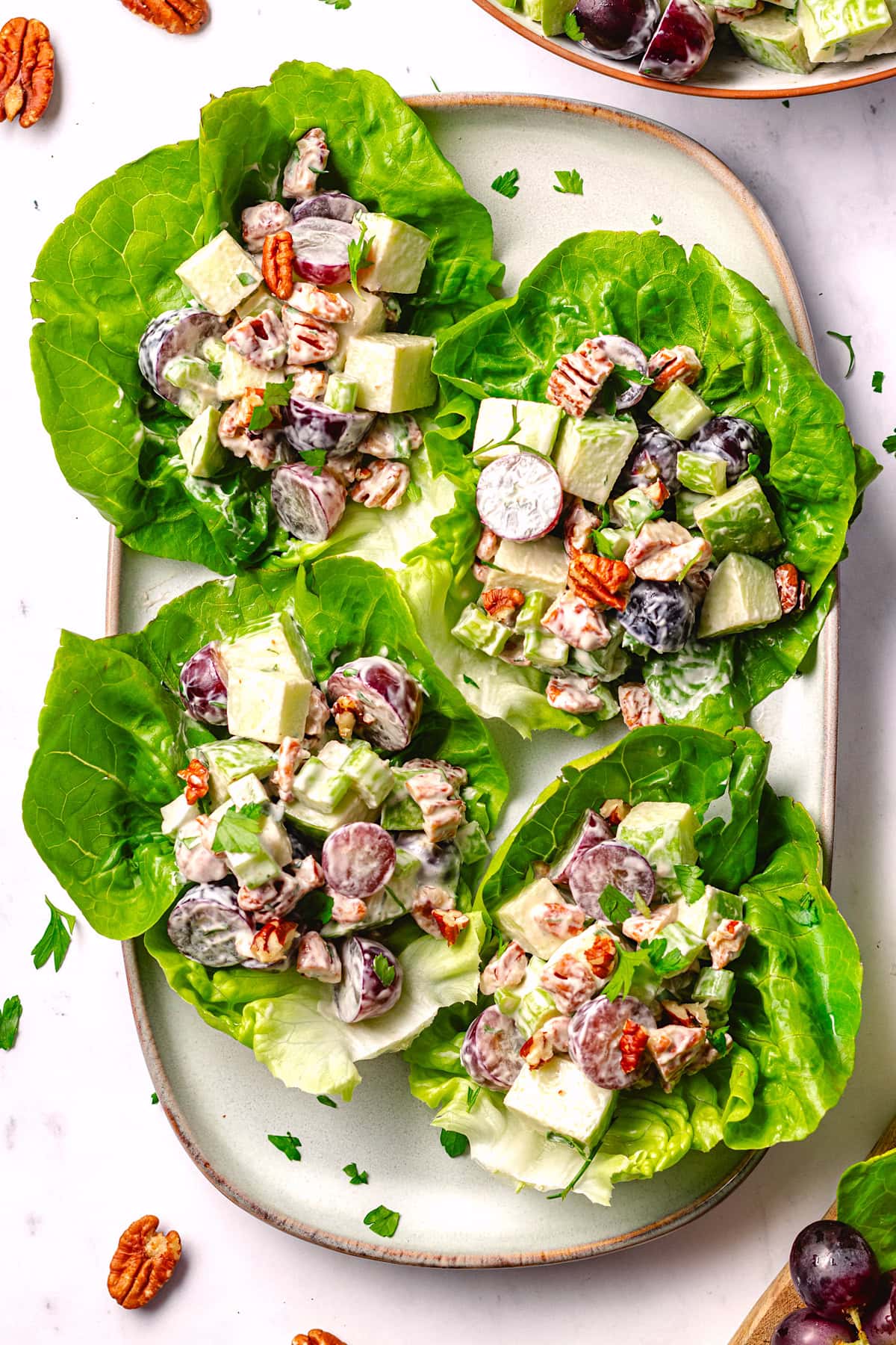 waldorf salad in lettuce cups on platter. 