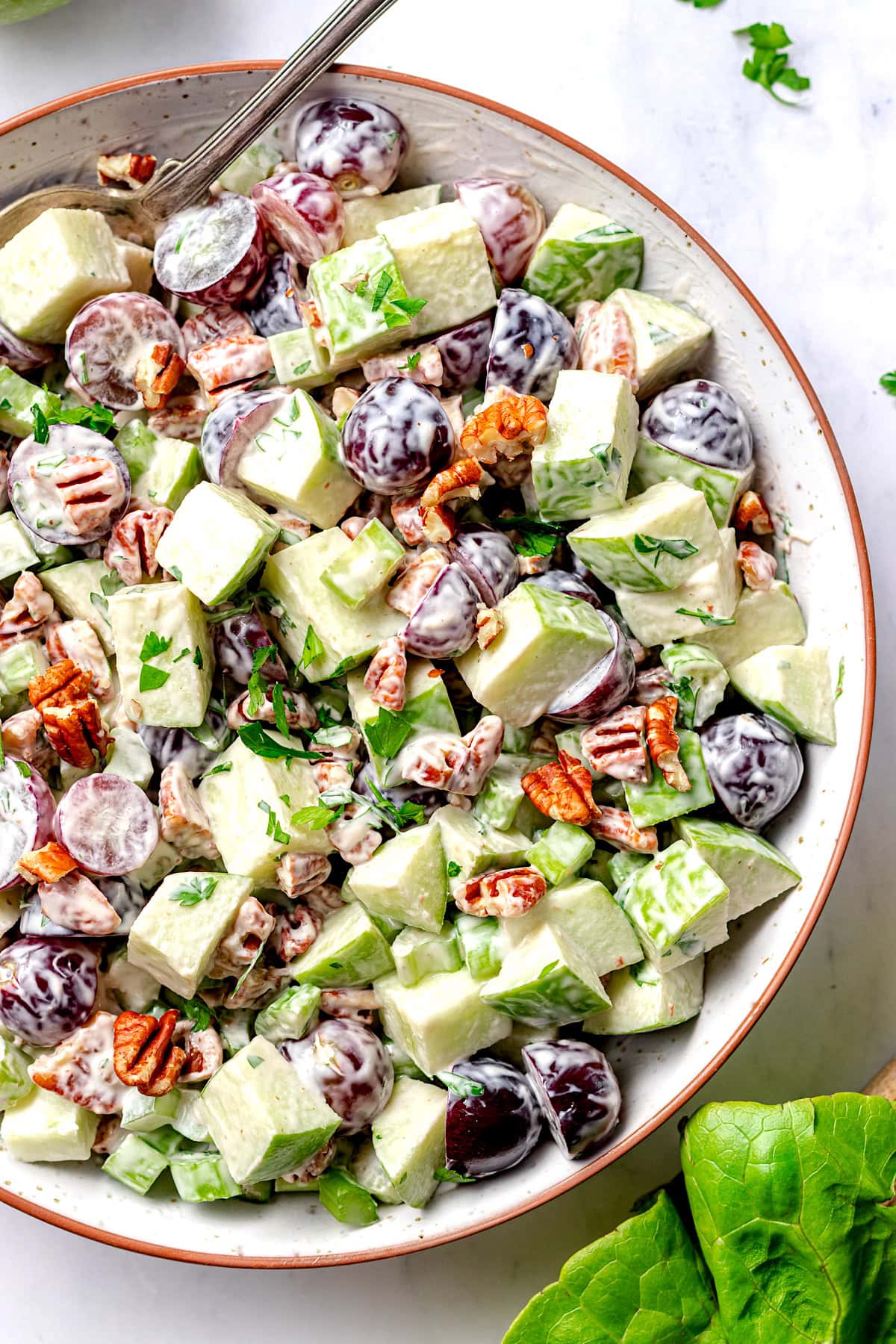 close up of waldorf salad in serving bowl. 