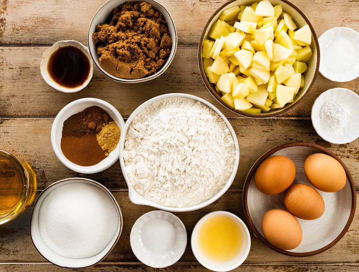 ingredients in bowls to make apple cake. 