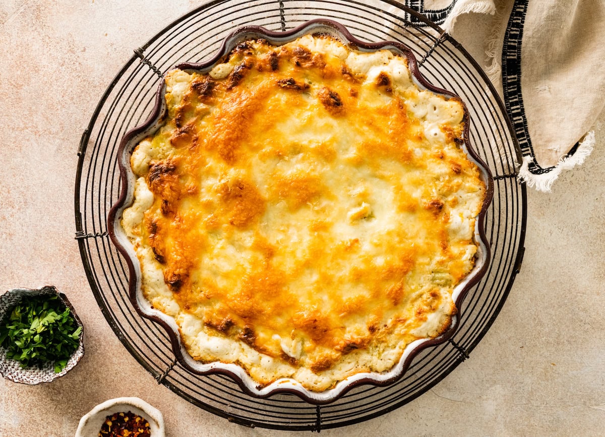 baked artichoke dip on cooling rack. 