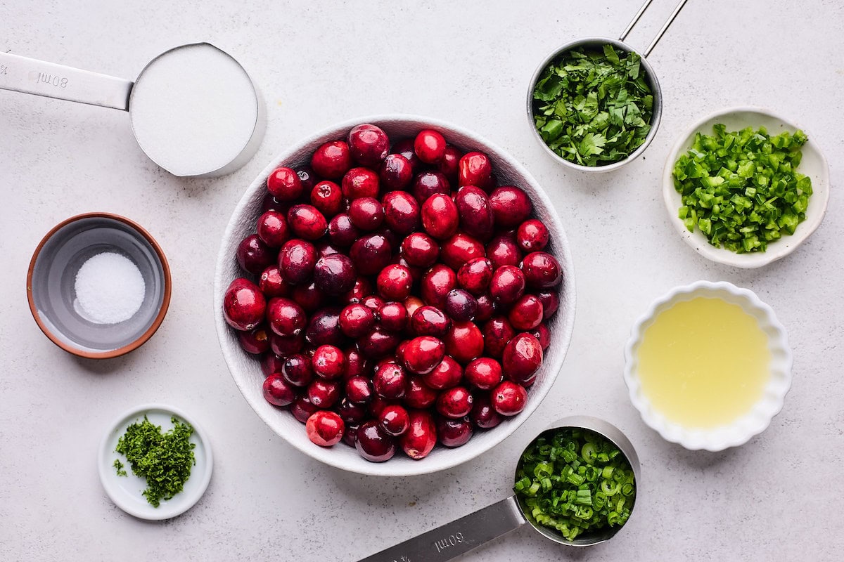 Cranberry salsa ingredients in bowls. 