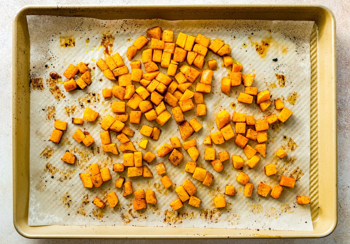 roasted butternut squash on baking sheet with parchment paper. 