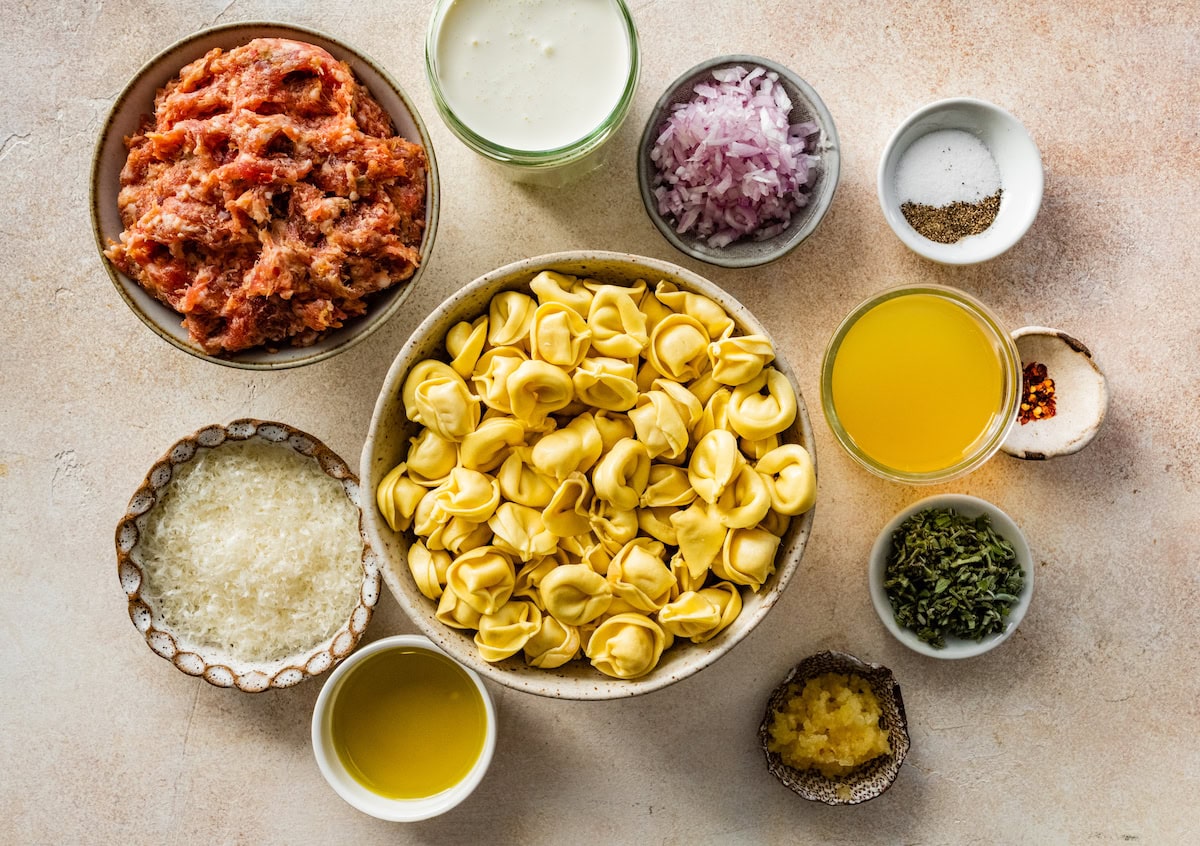 ingredients in bowls to make Creamy Tortellini with Butternut Squash & Sausage.