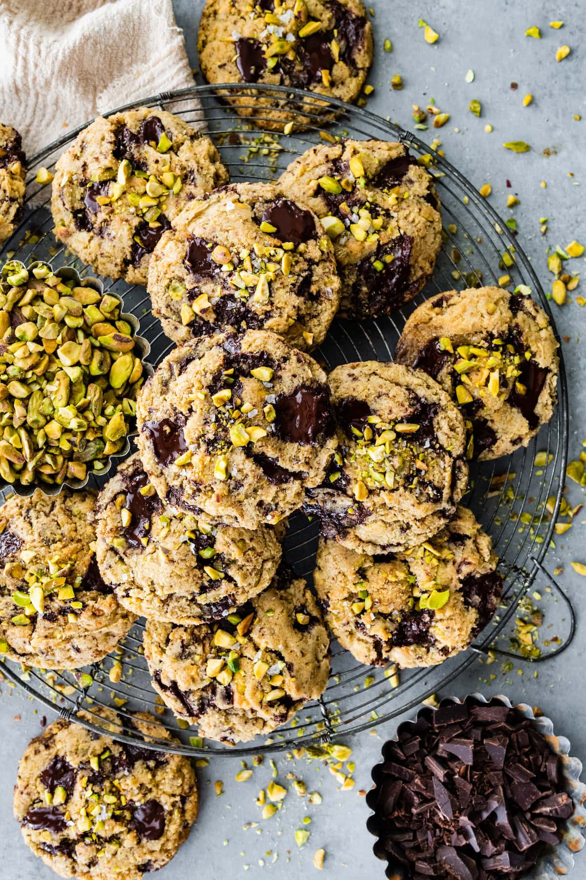 dark chocolate chunk pistachio cookies on cooling rack. 